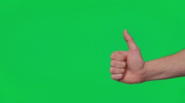 Mans hand shows gestures and signs of success on a chroma key green screen background. Thumb up. Gesture package. The concept of success, consent and approval. Template 4K.