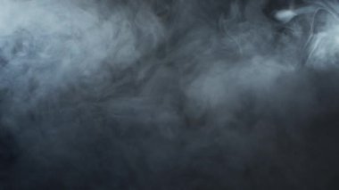 Smoke over black background. Fog or steam abstract dark texture pattern. Black background.