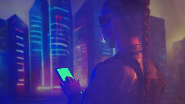 Portrait of cyberpunk girl. Beautiful young woman on the background of city scyscrapers. Futuristic concept.