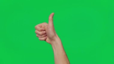 Mans hand shows gestures and signs of success on a chroma key green screen background. Thumb up. Gesture package. The concept of success, consent and approval. Template 4K.