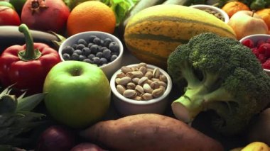 Healthy eating ingredients: fresh vegetables, fruits and superfood. Nutrition, diet, vegan food concept background