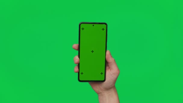 Male Hand Holding Smartphone Vertical Green Chroma Key Screen Isolated — Stock video