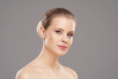 Close-up portrait of beautiful, fresh, healthy and sensual girl over isolated grey background