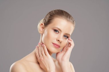Close-up portrait of beautiful, fresh, healthy and sensual girl over isolated grey background