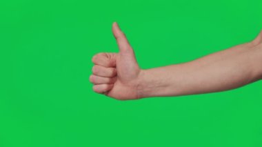 Male hand shows gestures and signs of success on a chroma key green screen background. Thumb up. Gesture package. The concept of success, consent and approval. Template 4K.