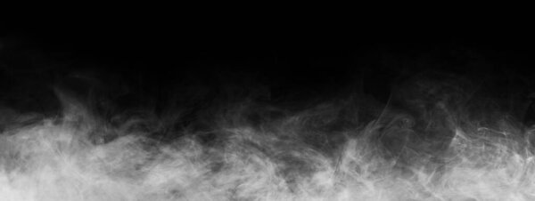 Abstract smoke texture over black background. Fog in the darkness.