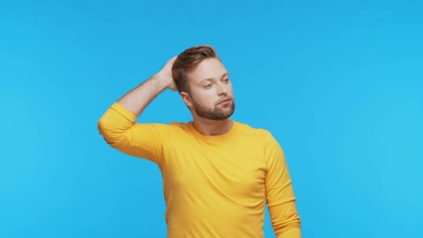 Thinking Young Man Vibrant Background Studio Portrait Expressive Handsome Person — Stock Video