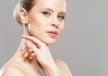 Close-up portrait of beautiful, fresh, healthy and sensual girl over isolated grey background