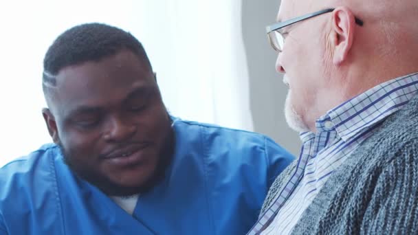 African American Caregiver Old Man Professional Nurse His Patient Nursing — Stock Video