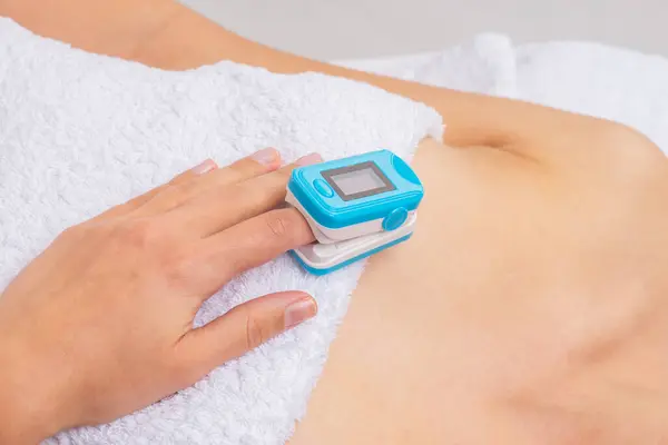 Woman Using Pulse Oximeter Home Close Female Hand Medical Equipment Stock Image