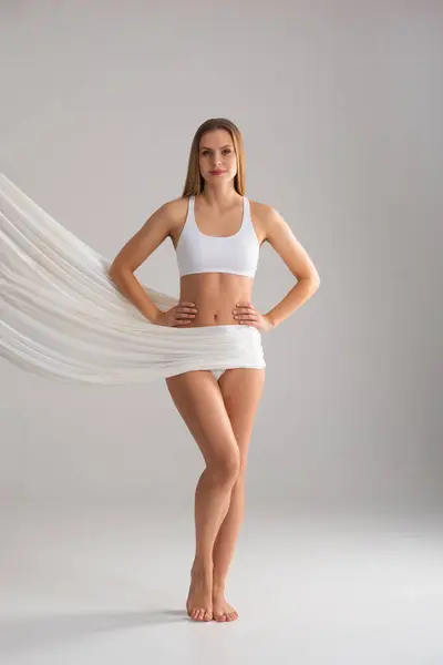 Young Fit Beautiful Blond Woman White Swimsuit Isolated Grey Background Rechtenvrije Stockafbeeldingen