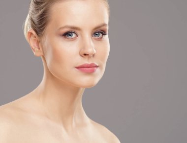 Close-up portrait of beautiful, fresh, healthy and sensual girl over isolated grey background