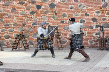 Mir, Belarus - 29 May 2024: reenactment of a knight's duel at the castle of Mir in Belarus clipart