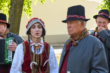 Vilnius, Lithuania - 26 May 2024: people in folk clothes singing in chorus at Vilnius on Lithuania clipart