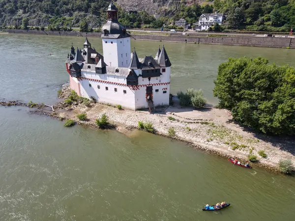 stock image Kaub, Germany - 20 July 2024: drone view at Pfalzgrafenstein water fort on river Rhine at Kaub in Germany