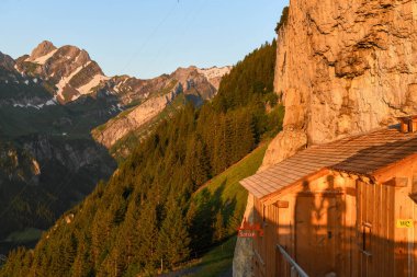 Ebenalp, Switzerland - 13 July 2024: view at the famous mountain guesthouse Aescher at Ebenalp in the Swiss alps clipart