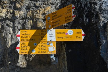 Path sign to guesthouse Aescher at Ebenalp in the Swiss alps clipart