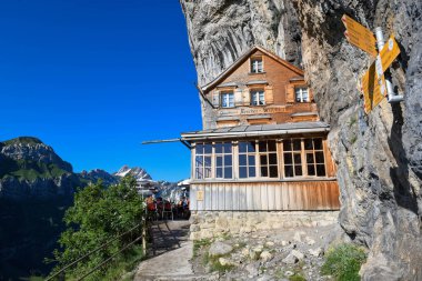 Ebenalp, Switzerland - 13 July 2024: view at the famous mountain guesthouse Aescher at Ebenalp in the Swiss alps clipart