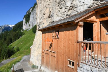 Ebenalp, Switzerland - 13 July 2024: view at the famous mountain guesthouse Aescher at Ebenalp in the Swiss alps clipart