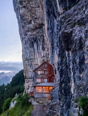 Ebenalp, Switzerland - 13 July 2024: view at the famous mountain guesthouse Aescher at Ebenalp in the Swiss alps clipart