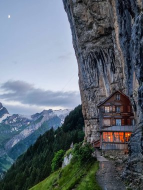 Ebenalp, Switzerland - 13 July 2024: view at the famous mountain guesthouse Aescher at Ebenalp in the Swiss alps clipart