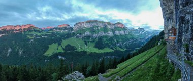 Ebenalp, Switzerland - 13 July 2024: view at the famous mountain guesthouse Aescher at Ebenalp in the Swiss alps clipart