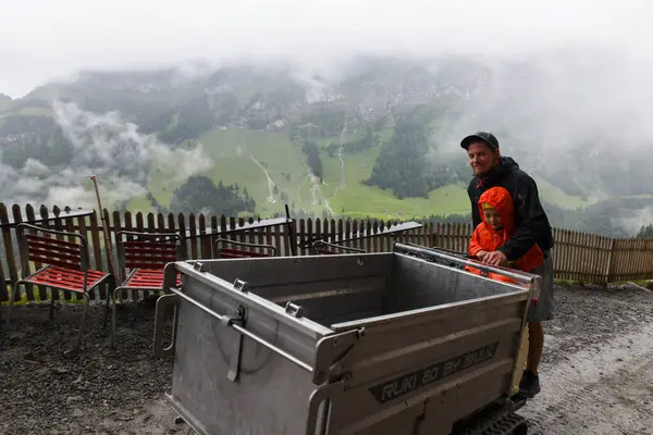 stock image Ebenalp, Switzerland - 13 July 2024: view at the famous mountain guesthouse Aescher at Ebenalp in the Swiss alps