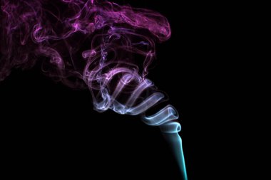 Multicolored smoke for aromatherapy and relaxation on black background, beautiful swirled puffs of smoke. Pink, purple and turquoise gradient colors of dense smoke, decorative multicolour smoke curls