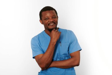Smiling black surgeon doctor bearded man in blue coat with isolated on white background. Happy adult black african american practicing surgeon portrait, confident look