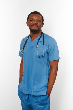 Black surgeon doctor bearded man in blue coat with stethoscope isolated on white background. Serious adult black african american practicing surgeon portrait, confident candid male face emotion