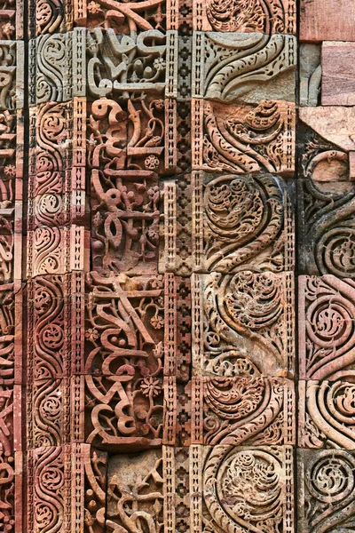 stock image Wall decorative patterns of Qutb complex in South Delhi, India, close up ancient bas relief wall decorations of mosque ruins landmark, popular touristic spot in New Delhi, ancient indian architecture