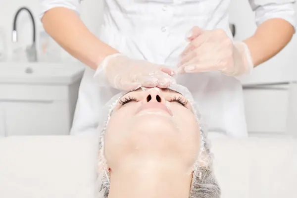 Cosmetologist Massages Cream Mask Woman Face Skin Rejuvenation Aging Skincare — Stock Photo, Image