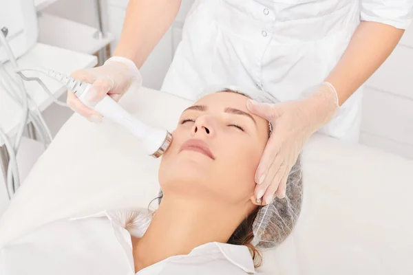 Cosmetologist Makes Ultrasound Skin Tightening Rejuvenation Woman Face Using Phonophoresis Stock Picture