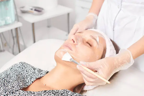 Beautician Applying Cosmetic Cream Mask Woman Face Rejuvenation Face Skin — Stock Photo, Image
