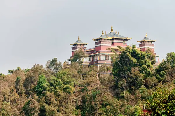 stock image Tibetan temple on mountain shrouded in green vegetation amidst peaceful nature inviting visitors to connect with nature and find inner peace, Amitabha Foundation Retreat Center