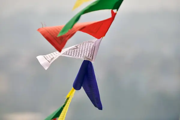 stock image Colorful Tibetan prayer flags on blurred Kathmandu cityscape background symbolizing cultural value and spiritual heritage of Nepali region, connection between earthly and spiritual realms