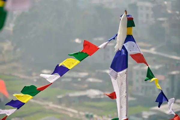 stock image Colorful Tibetan prayer flags on blurred Kathmandu cityscape background symbolizing cultural value and spiritual heritage of Nepali region, connection between earthly and spiritual realms