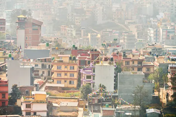 stock image View of Kathmandu capital of Nepal from mountain through urban haze with lot of low rise buildings, cityscape creating an ethereal atmosphere in mountain air, Kathmandu air pollution