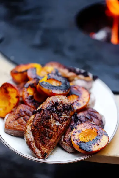 Duck Breast with peach on the outdoor grill.style rustic.selective focus