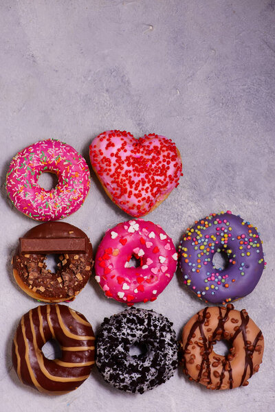 assorted donuts with different fillings.top veiw.selective focus