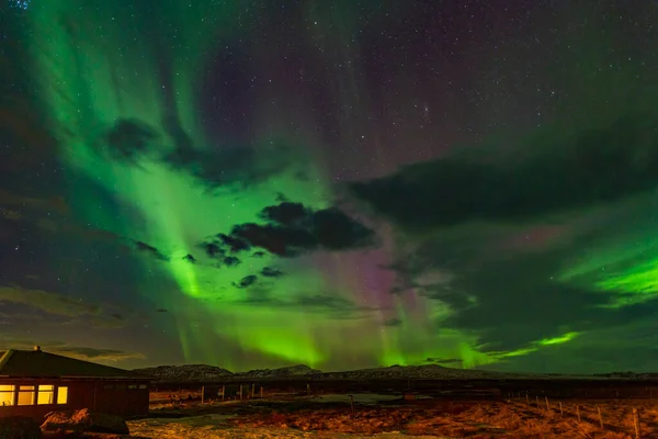 stock image Northern lights in the night sky in Iceland.