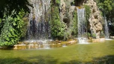 Water falls in slow motion at the Genoves Garden, Cadiz, Spain.