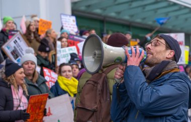 London, UK. 18th January 2023. Striking nurses with placards and banners, demonstrating outside the main entrance of University College Hospital, London, in protest to government cuts and unfair pay.