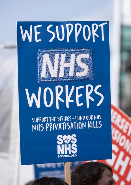 stock image London, UK. 11th March 2023. Protest signs at the SOS NHS National Demo in London, supporting  striking healthcare workers and in protest of the crisis caused by government cuts and mismanagement