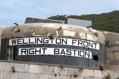 Low angle view of the Wellington Front Right Bastion casemates at Gibraltar, built during the 1840s and seen here against a clear blue sky. clipart
