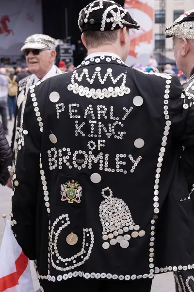 stock image Trafalgar Square, London, UK. 24th April 2024. Chris Conlan the Pearly King of Bromley, enjoying the festivities at the Saint George's Day celebration held in Trafalgar Square, London.