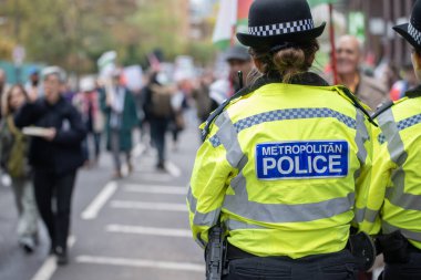 London, UK. 2nd Nov 2024. Metropolitan Police officer on duty during the National March for Palestine rally, escorting and monitoring the rally through the streets of London, to ensure public safety. clipart