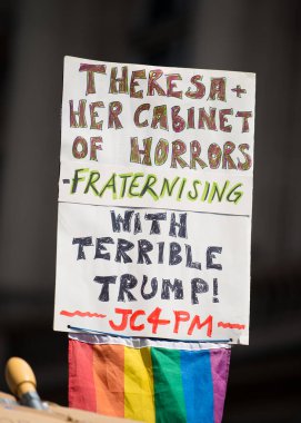 London, UK. 13th July 2018.  Anti Donald Trump protest sign at the #BringTheNoise Women's March, in protest of the US president's controversial visit to the UK and show resistance to his misogyny and racism. clipart