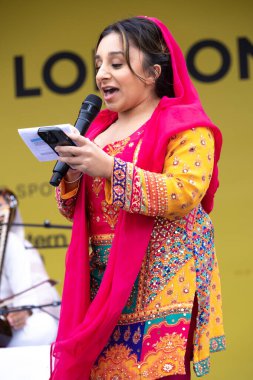 London UK.  6th April 2024. Shani Dhanda presenting at the Vaisakhi Festival in Trafalgar Square, the event celebrating Sikh culture and the traditional spring harvest in the Sikh calendar. clipart