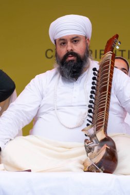 London, UK. 6th April 2024. Kirpal Singh Panesar performing on the Tar shehnai at the Vaisakhi Festival in Trafalgar Square, the event celebrating Sikh culture and the traditional spring harvest. clipart